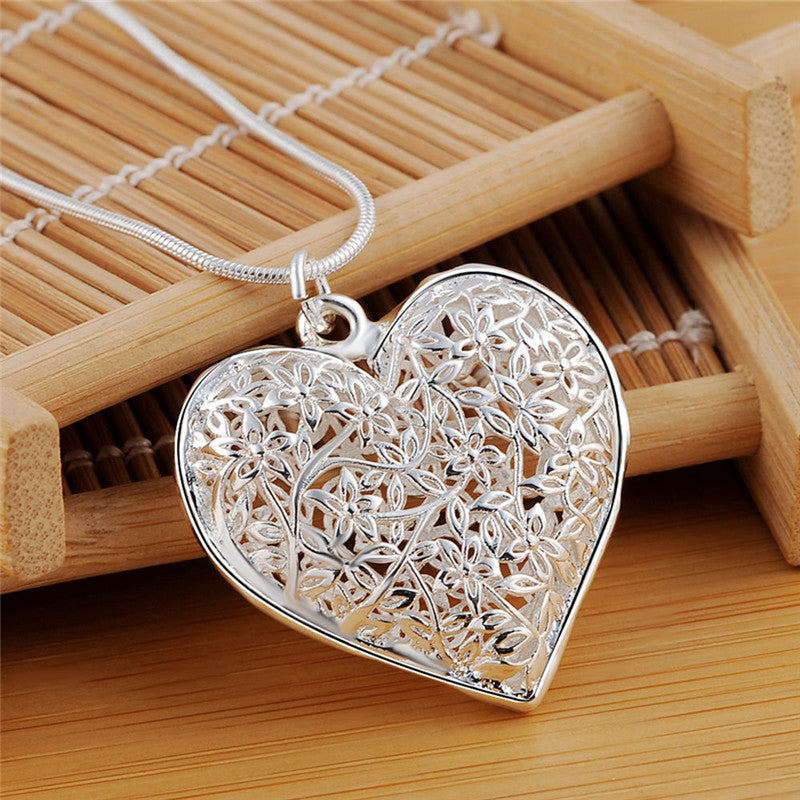Elegance Carved Silver Necklace