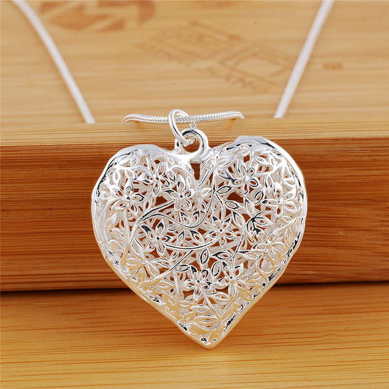 Elegance Carved Silver Necklace